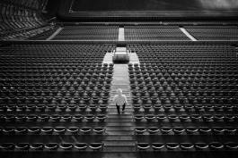 Person Ascending Stadium Stairs 