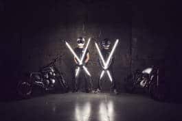 Bikers holding glowing sticks 