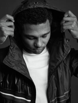 Serge Gnabry holding hood 